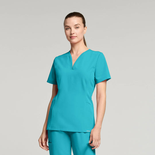Jaanuu Scrubs Women's Calix Fit & Flare Scrub Top Marina | scrub-supply.com