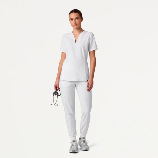 Jaanuu Scrubs Women's Calix Fit & Flare Scrub Top White | scrub-supply.com