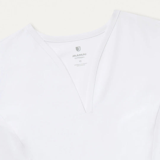 Jaanuu Scrubs Women's Calix Fit & Flare Scrub Top White | scrub-supply.com