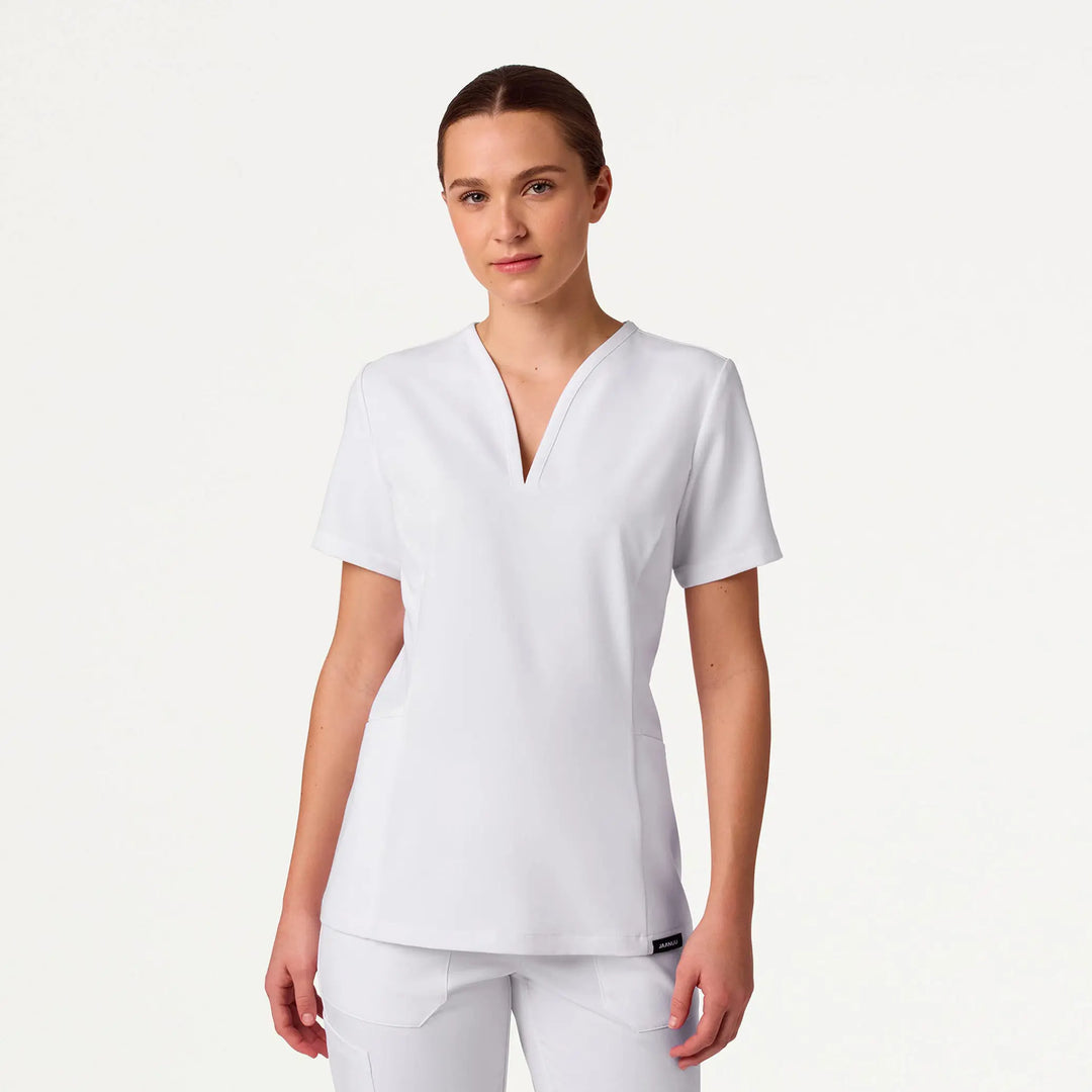 Jaanuu Scrubs Women's Calix Fit & Flare Scrub Top White | scrub-supply.com