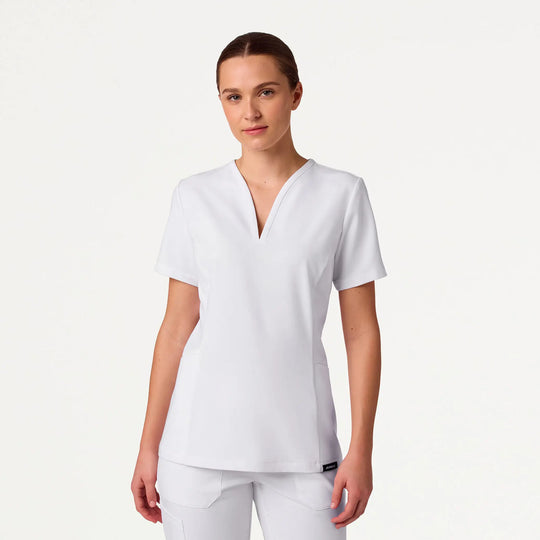 Jaanuu Scrubs Women's Calix Fit & Flare Scrub Top White | scrub-supply.com
