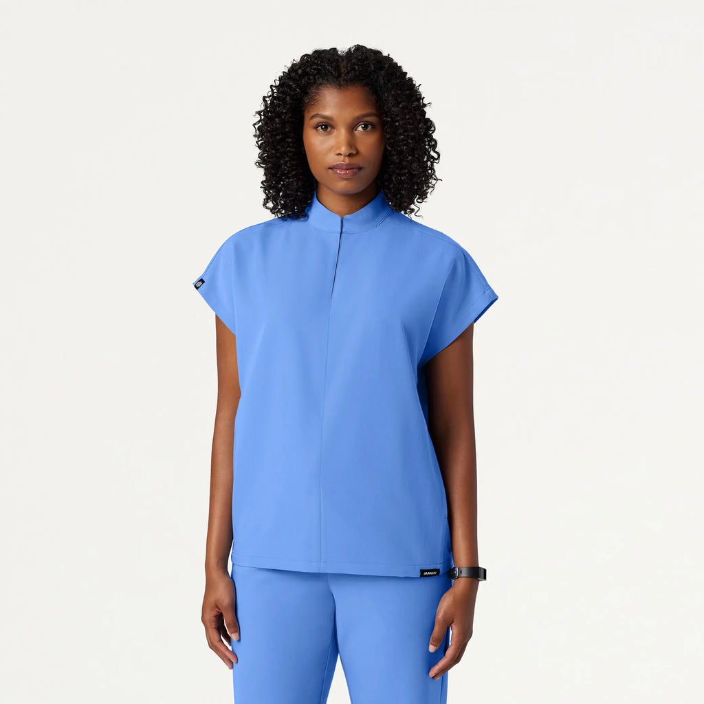 Jaanuu Scrubs Women's Aris Oversized 2-Pocket Scrub Top Ceil Blue | scrub-supply.com