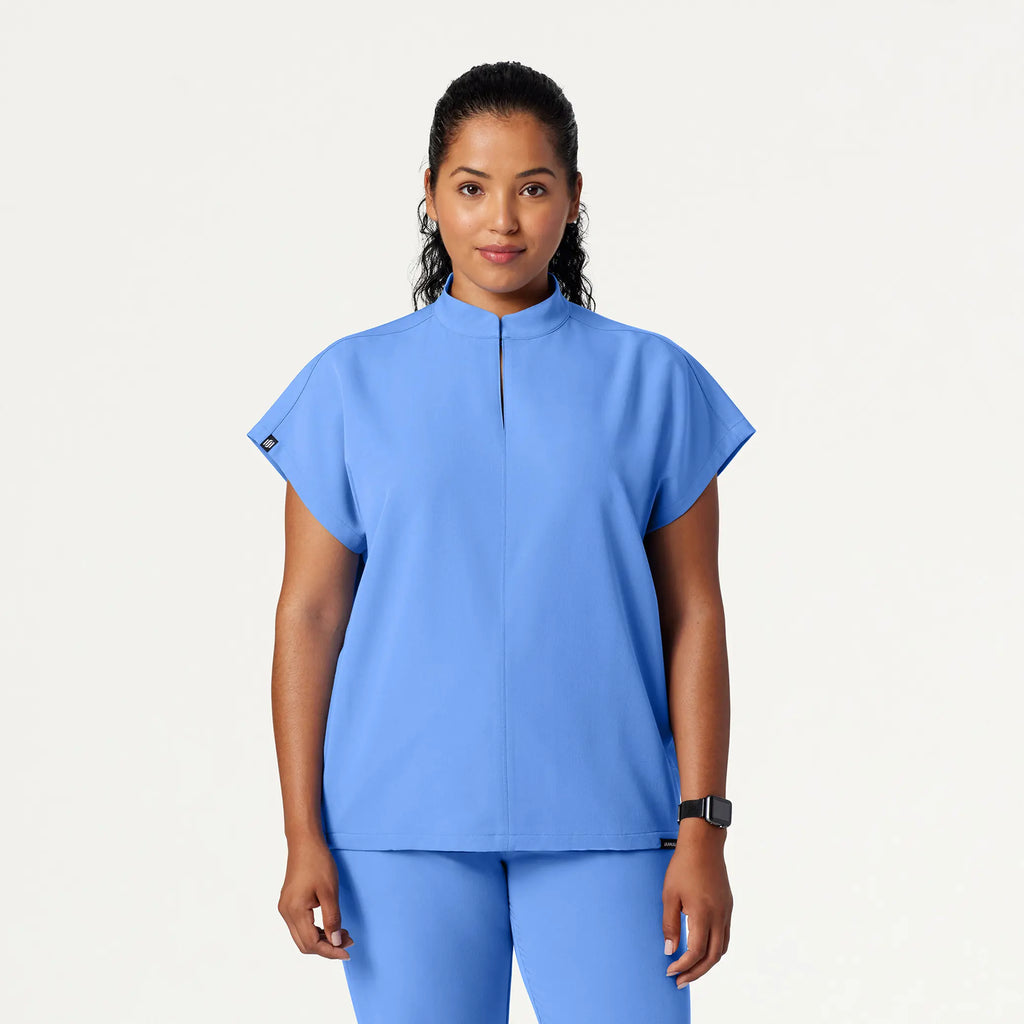 Jaanuu Scrubs Women's Aris Oversized 2-Pocket Scrub Top Ceil Blue | scrub-supply.com