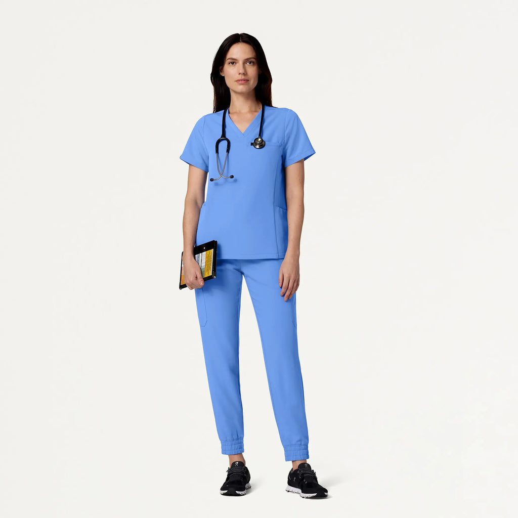 Jaanuu Scrubs Women's Magna 3-Pocket Scrub Top Ceil Blue | scrub-supply.com