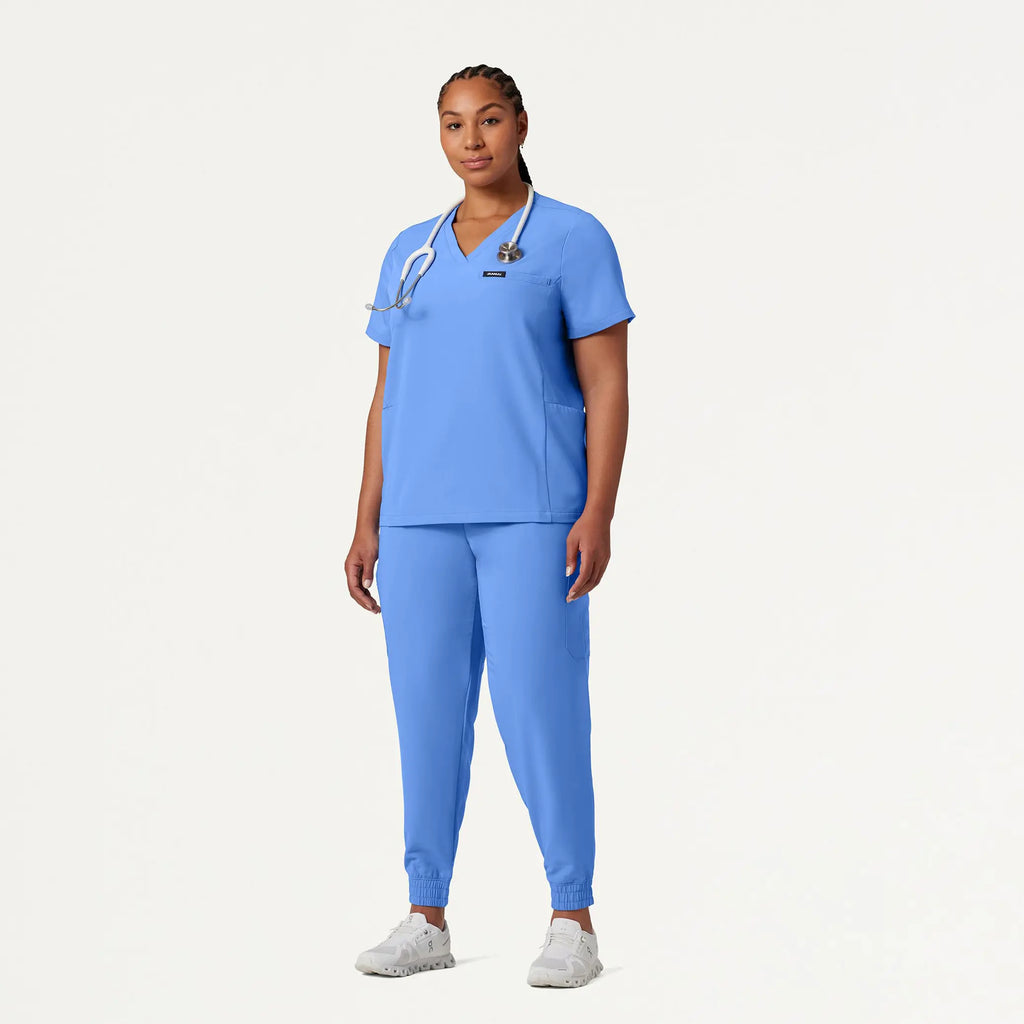 Jaanuu Scrubs Women's Magna 3-Pocket Scrub Top Ceil Blue | scrub-supply.com