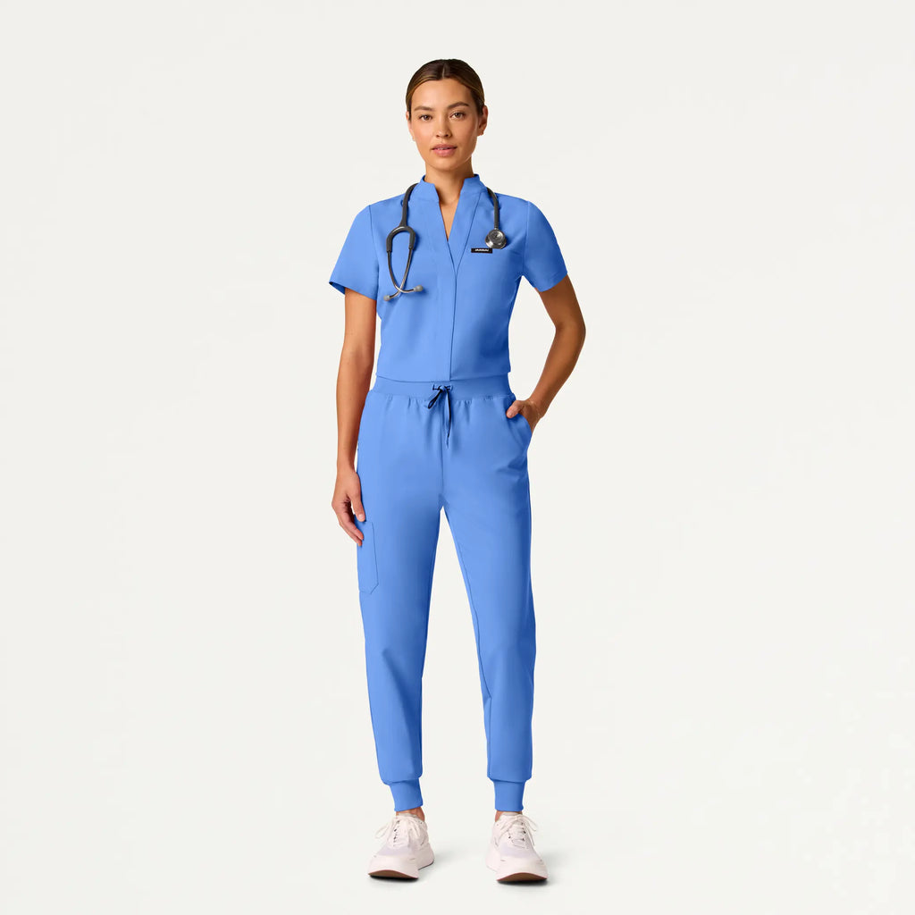 Jaanuu Scrubs Women's Serin Slim 1-Pocket Scrub Top Ceil Blue | scrub-supply.com