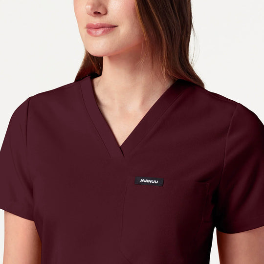 Jaanuu Scrubs Women's Rhena Slim 1-Pocket Scrub Top Burgundy | scrub-supply.com
