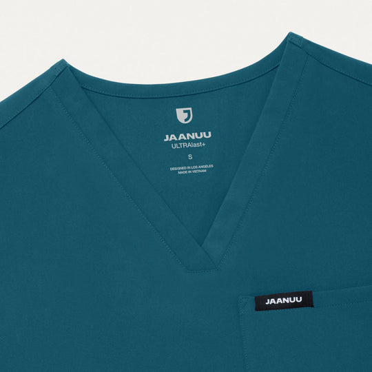 Jaanuu Scrubs Women's Rhena Slim 1-Pocket Scrub Top Caribbean Blue | scrub-supply.com