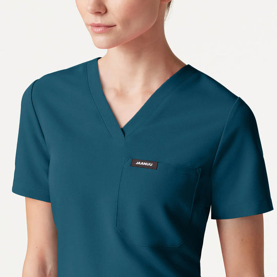 Jaanuu Scrubs Women's Rhena Slim 1-Pocket Scrub Top Caribbean Blue | scrub-supply.com
