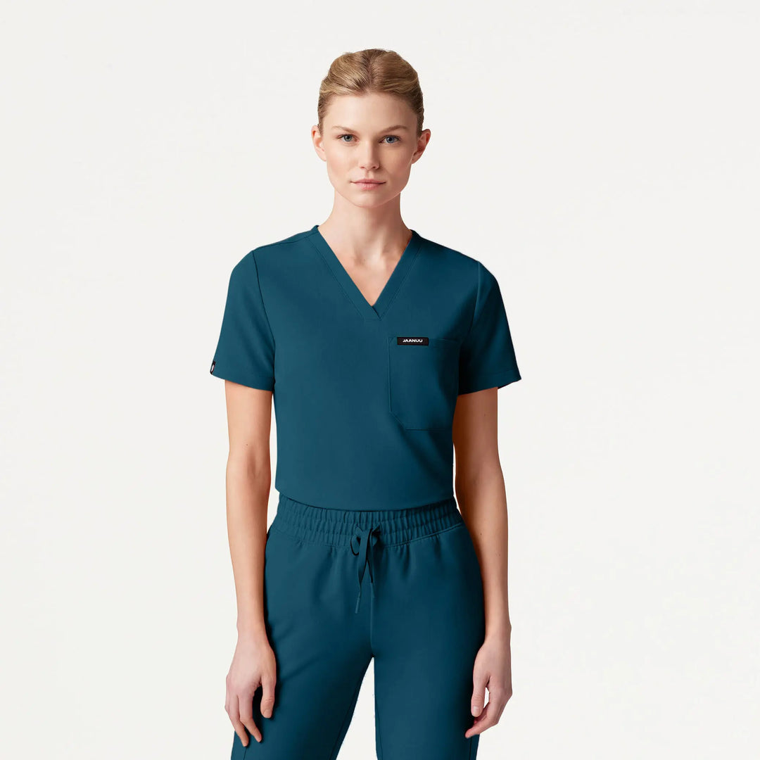 Jaanuu Scrubs Women's Rhena Slim 1-Pocket Scrub Top Caribbean Blue | scrub-supply.com