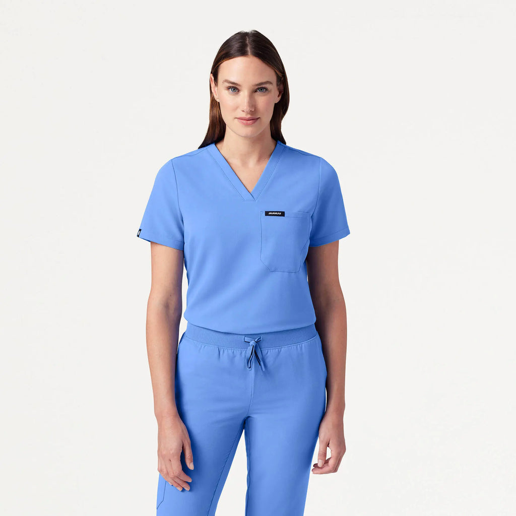 Jaanuu Scrubs Women's Rhena Slim Essential 1-Pocket Scrub Top Ceil Blue | scrub-supply.com