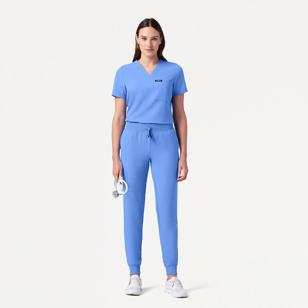 Jaanuu Scrubs Women's Rhena Slim Essential 1-Pocket Scrub Top Ceil Blue | scrub-supply.com