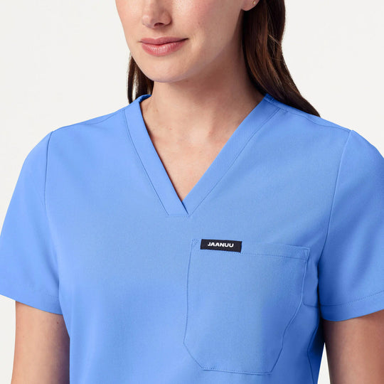 Jaanuu Scrubs Women's Rhena Slim 1-Pocket Scrub Top Ceil Blue | scrub-supply.com