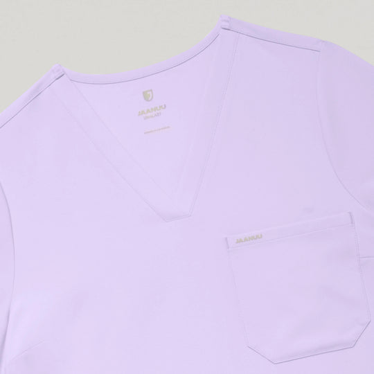 Jaanuu Scrubs Women's Rhena Slim 1-Pocket Scrub Top Lavender | scrub-supply.com