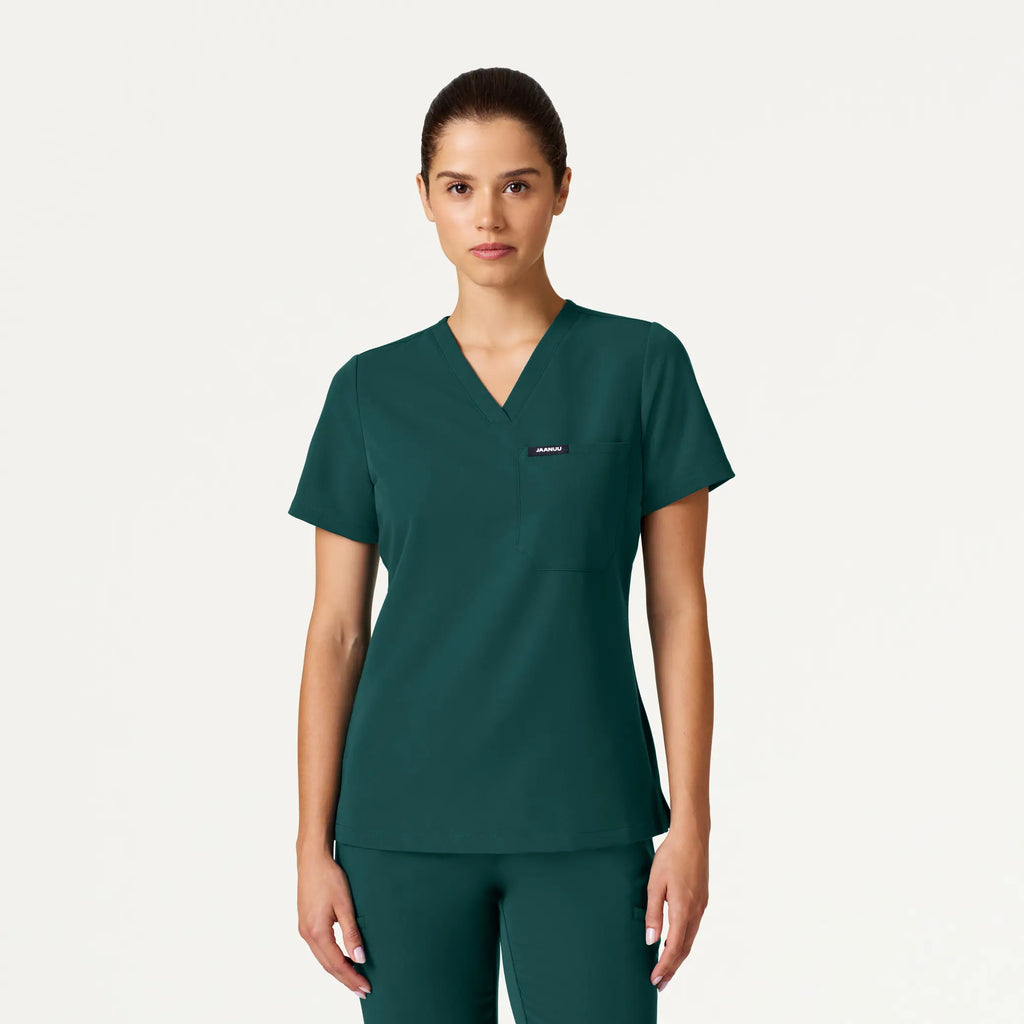 Jaanuu Scrubs Women's Rhena Slim Essential 1-Pocket Scrub Top Midnight Green | scrub-supply.com