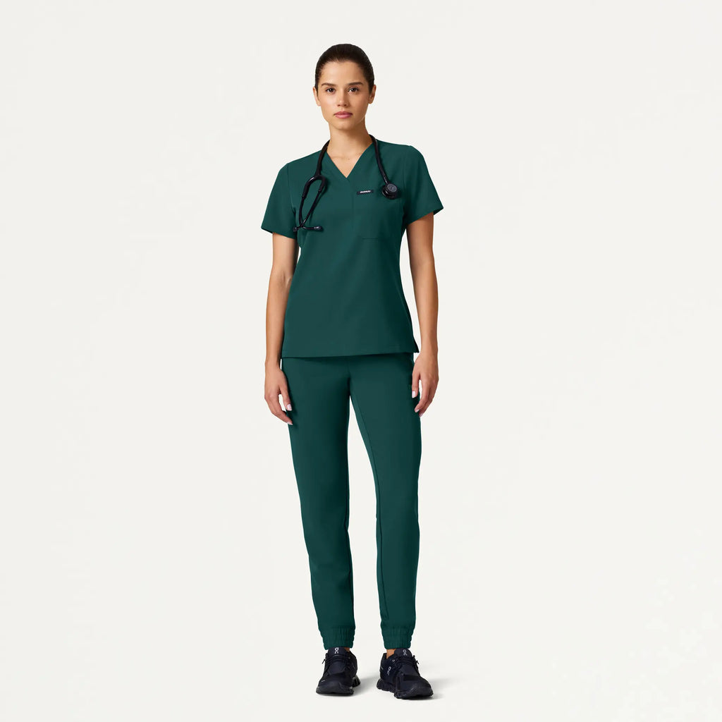 Jaanuu Scrubs Women's Rhena Slim Essential 1-Pocket Scrub Top Midnight Green | scrub-supply.com