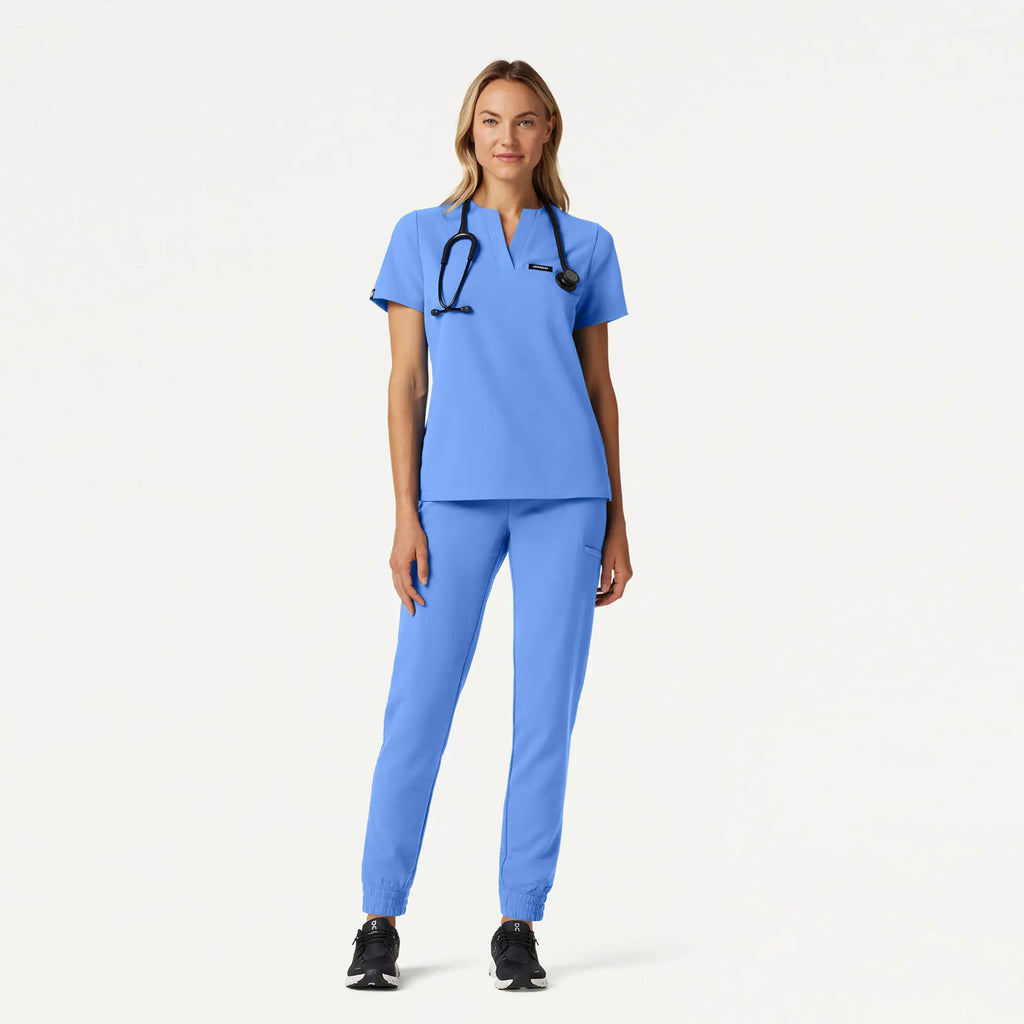 Jaanuu Scrubs Women's Andra Slim 1-Pocket Scrub Top Ceil Blue | scrub-supply.com