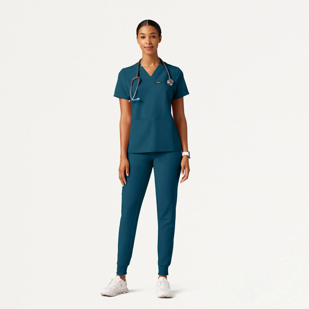 Jaanuu Scrubs Women's Helia Slim Notched V-Neck Scrub Top Caribbean Blue | scrub-supply.com