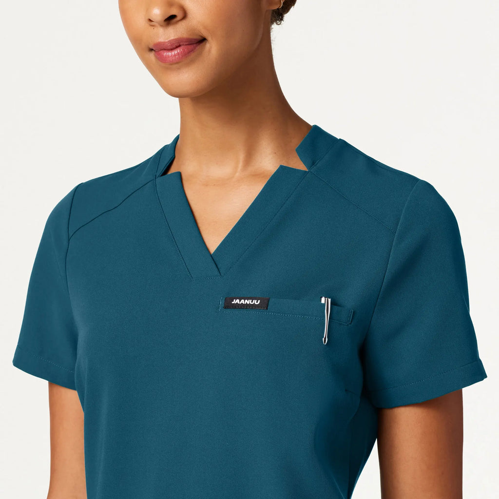 Jaanuu Scrubs Women's Helia Slim Notched V-Neck Scrub Top Caribbean Blue | scrub-supply.com