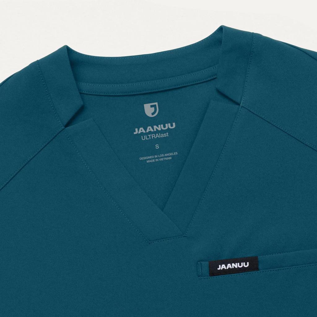 Jaanuu Scrubs Women's Helia Slim Notched V-Neck Scrub Top Caribbean Blue | scrub-supply.com