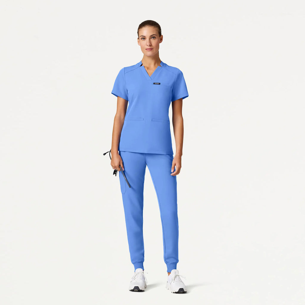 Jaanuu Scrubs Women's Helia Slim Notched V-Neck Scrub Top Ceil Blue | scrub-supply.com