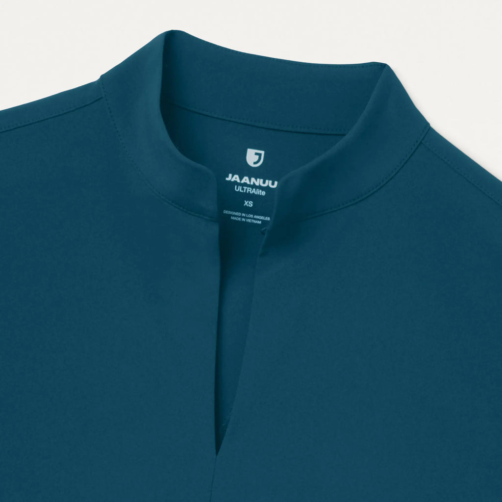 Jaanuu Scrubs Women's Aria Fit & Flare ULTRAlite™ Scrub Top Caribbean Blue | scrub-supply.com