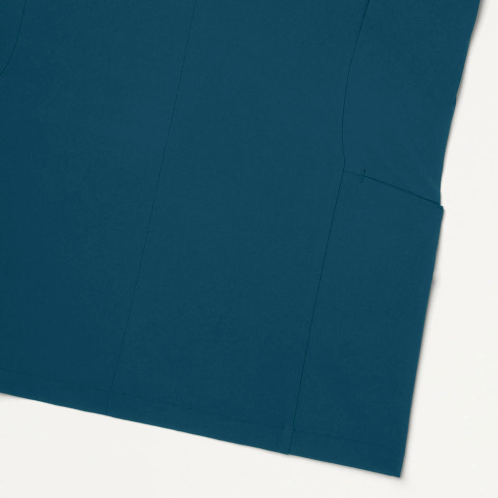 Jaanuu Scrubs Women's Aria Fit & Flare ULTRAlite™ Scrub Top Caribbean Blue | scrub-supply.com