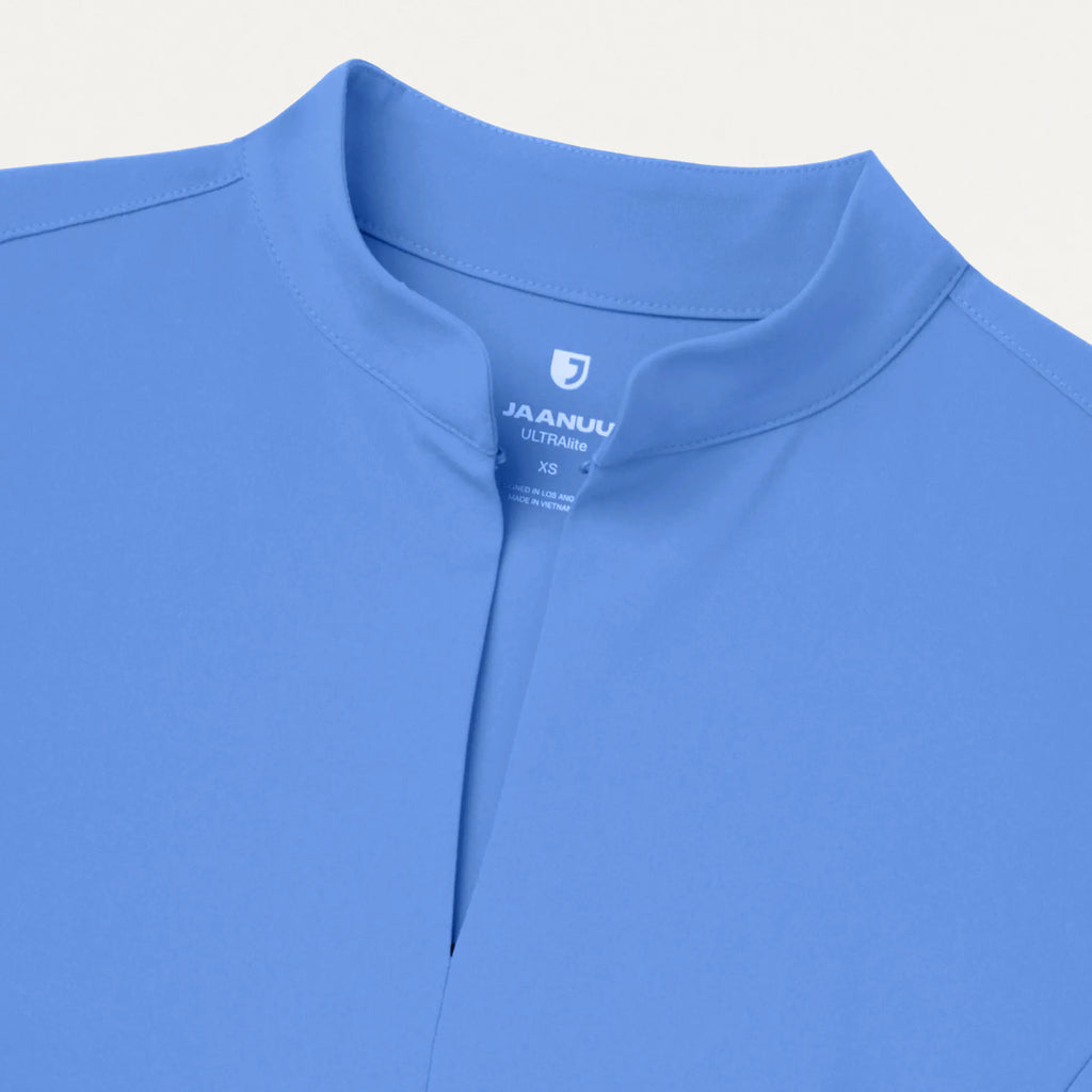 Jaanuu Scrubs Women's Aria Fit & Flare ULTRAlite™ Scrub Top Ceil Blue | scrub-supply.com