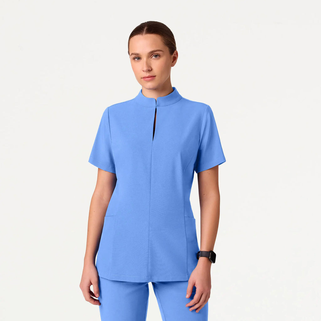 Jaanuu Scrubs Women's Aria Fit & Flare ULTRAlite™ Scrub Top Ceil Blue | scrub-supply.com