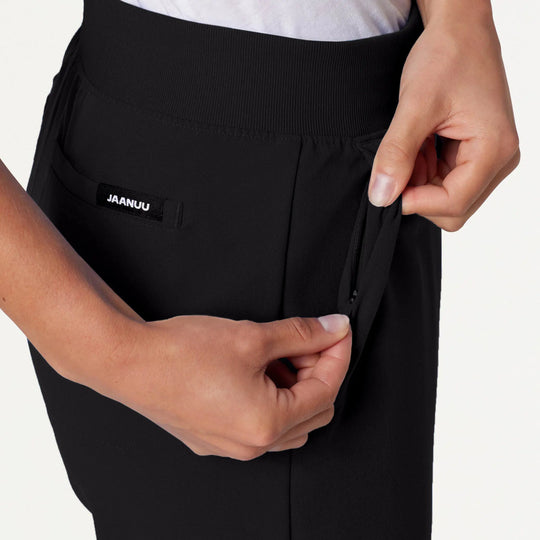 Jaanuu Scrubs Women's Xenos Essential Knit-Waist Scrub Pant Black | scrub-supply.com