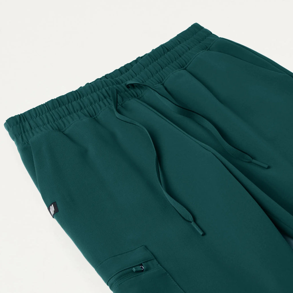 Jaanuu Scrubs Women's Neo Everyday Cargo Scrub Jogger Midnight Green | scrub-supply.com