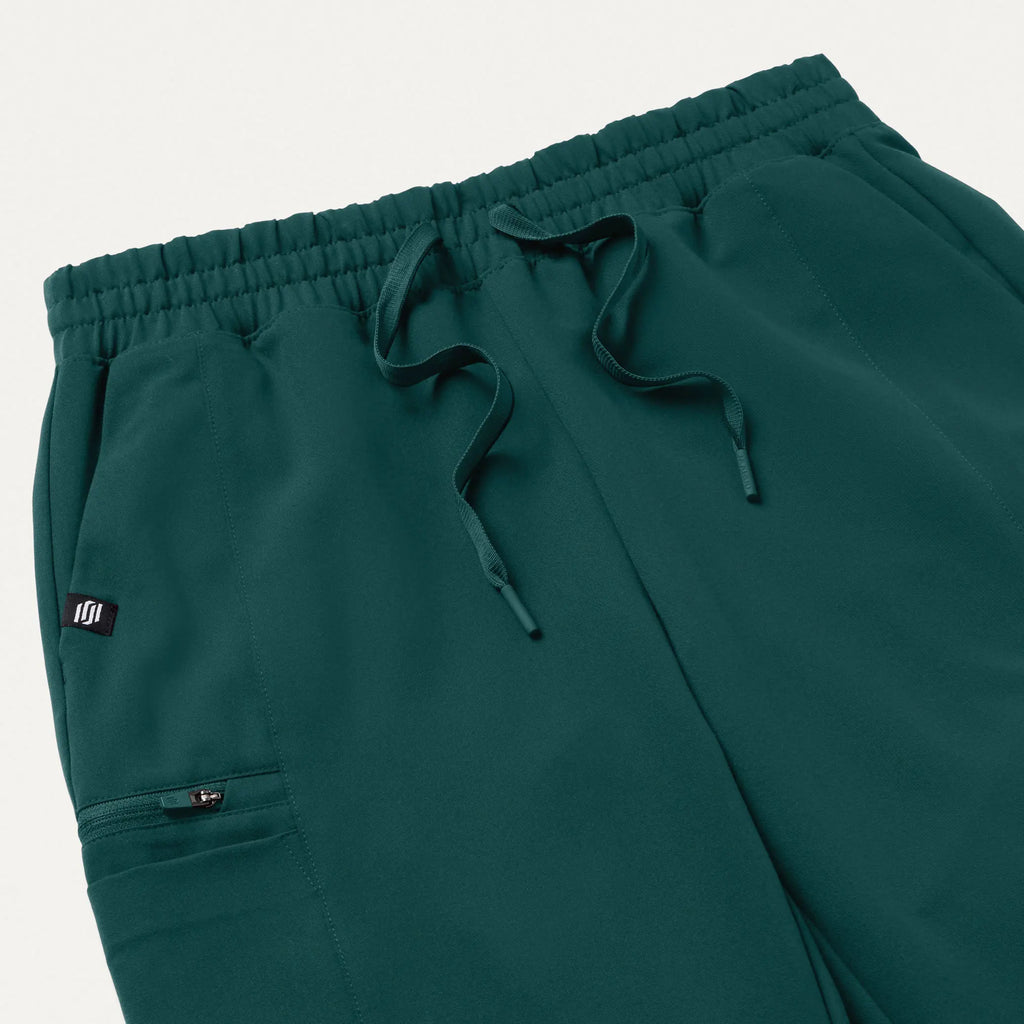 Jaanuu Scrubs Women's Payla 8-Pocket High Waisted Scrub Pant Midnight Green | scrub-supply.com