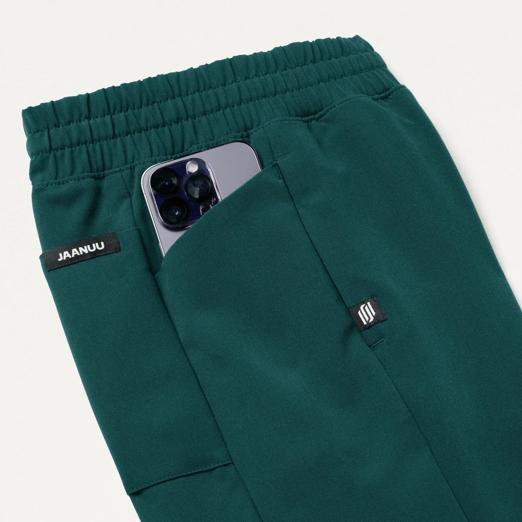 Jaanuu Scrubs Women's Effie Slim 6-Pocket Scrub Pant Midnight Green | scrub-supply.com