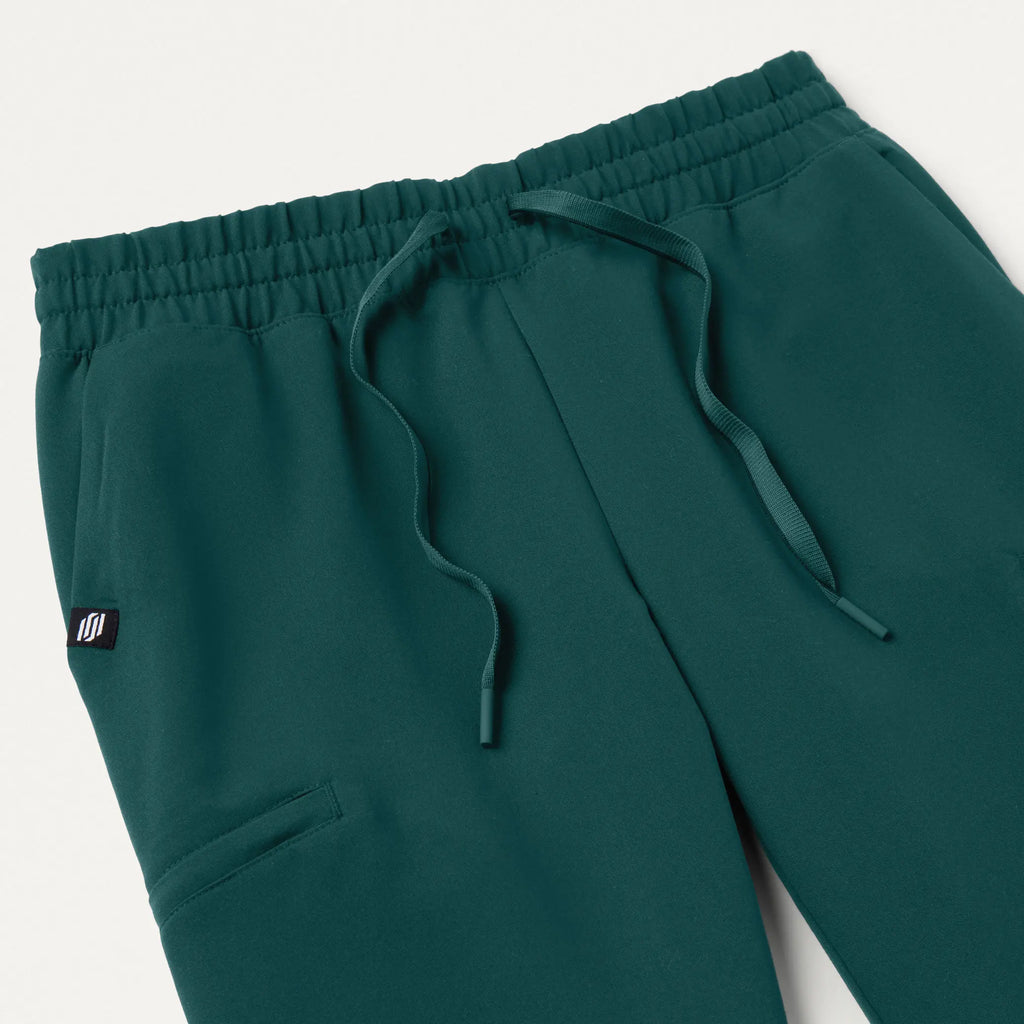 Jaanuu Scrubs Women's Jace Skinny On-the-Go Scrub Jogger Midnight Green | scrub-supply.com