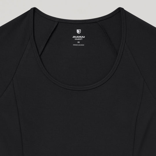 Jaanuu Scrubs Women's Sorrell Peplum Scrub Top Black | scrub-supply.com