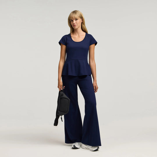 Jaanuu Scrubs Women's Sorrell Peplum Scrub Top Midnight Navy | scrub-supply.com