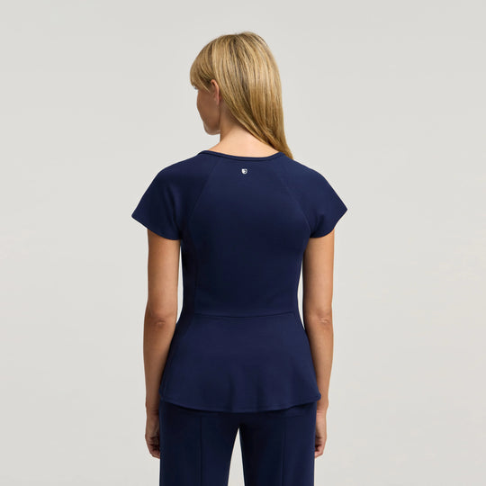 Jaanuu Scrubs Women's Sorrell Peplum Scrub Top Midnight Navy | scrub-supply.com