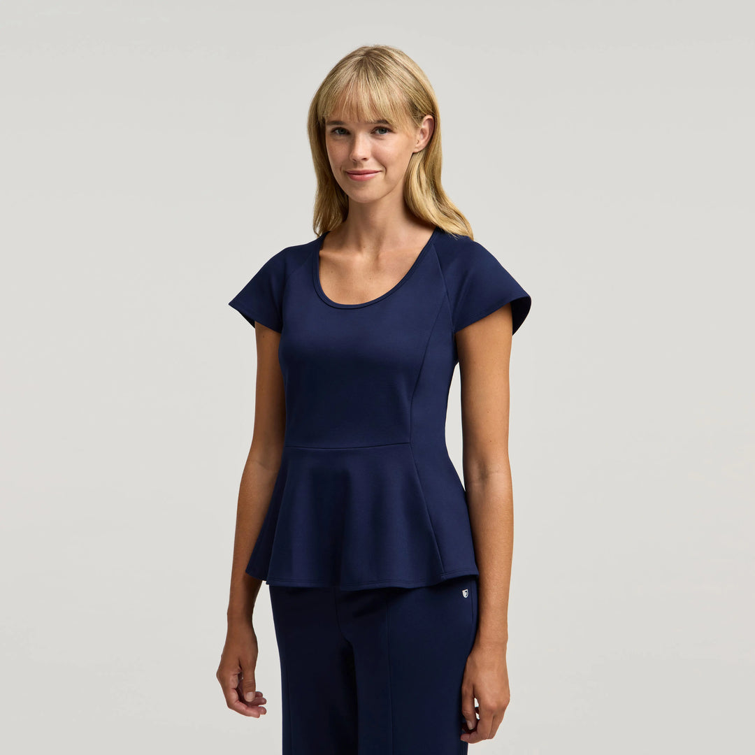 Jaanuu Scrubs Women's Sorrell Peplum Scrub Top Midnight Navy | scrub-supply.com