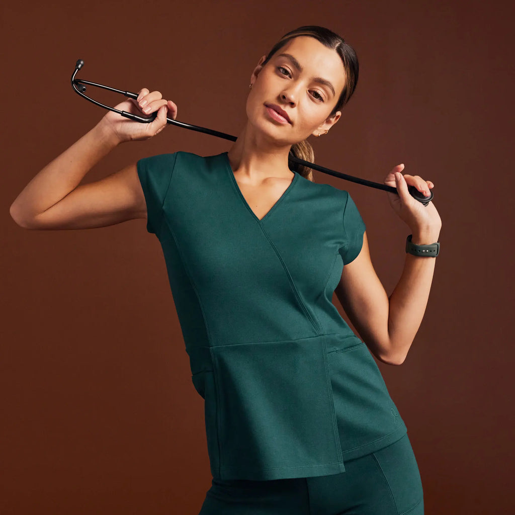 Jaanuu Scrubs Women's Isla Mock-Wrap ULTRAsoft Scrub Top Midnight Green | scrub-supply.com