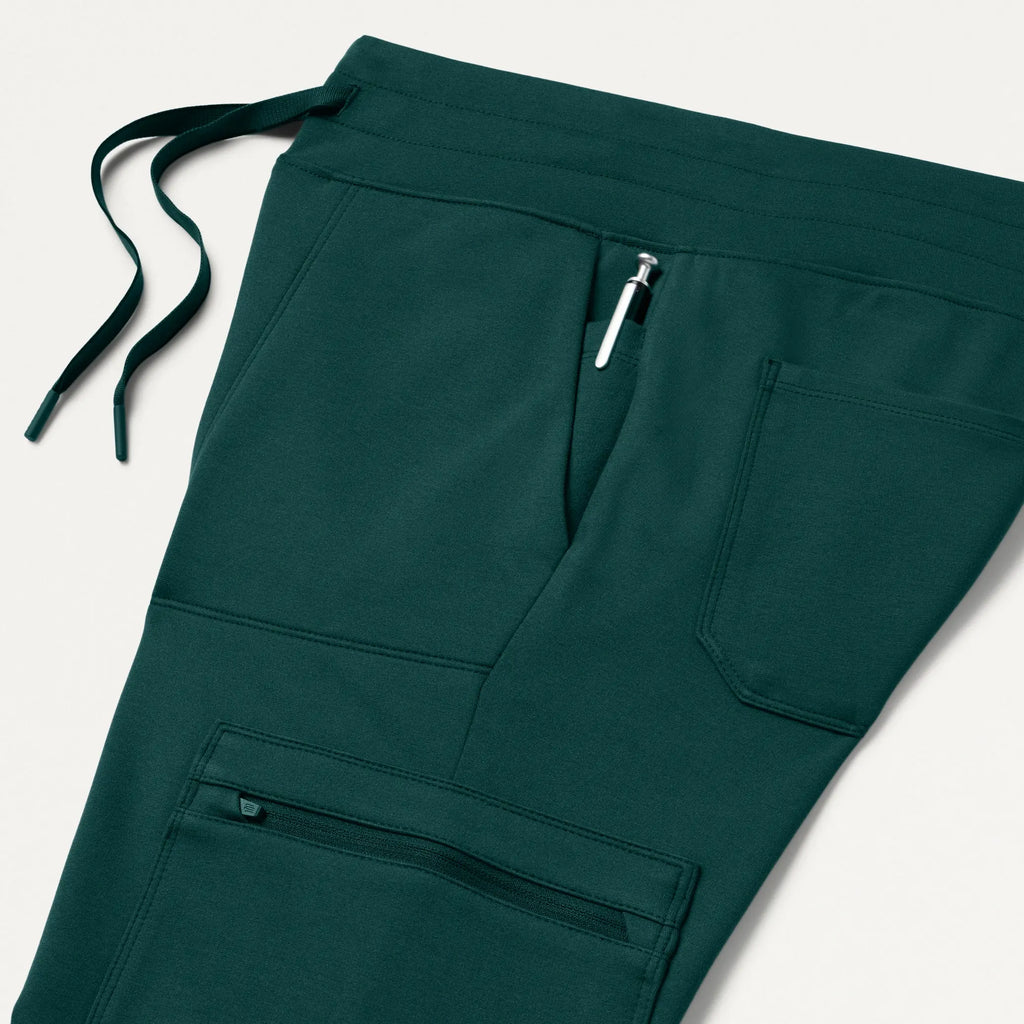 Jaanuu Scrubs Women's Kait 10-Pocket Skinny ULTRAsoft Scrub Jogger Midnight Green | scrub-supply.com