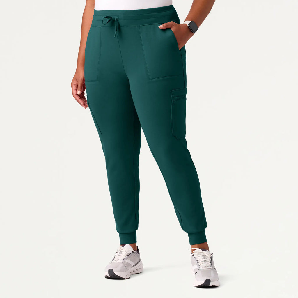 Jaanuu Scrubs Women's Abi 10-Pocket Skinny ULTRAsoft Scrub Jogger Midnight Green | scrub-supply.com