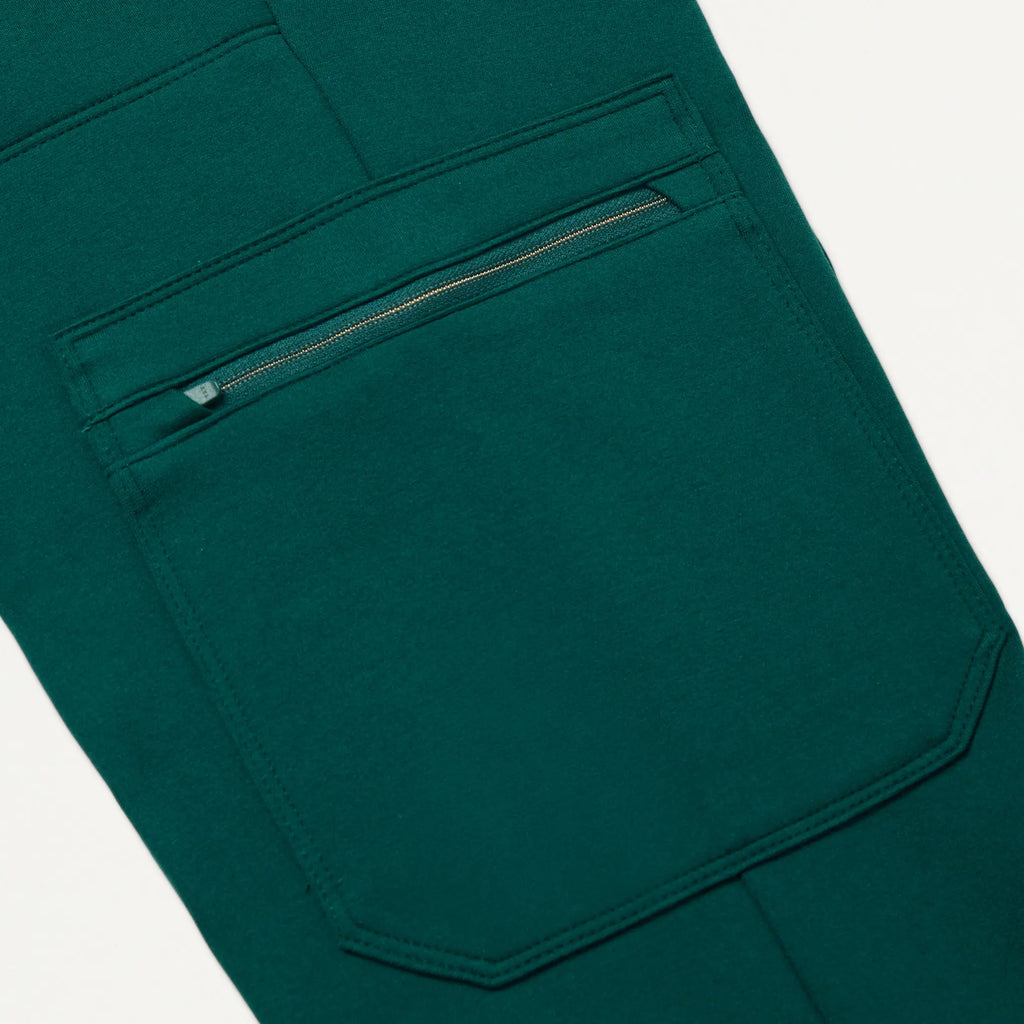 Jaanuu Scrubs Women's Abi 10-Pocket Skinny ULTRAsoft Scrub Jogger Midnight Green | scrub-supply.com