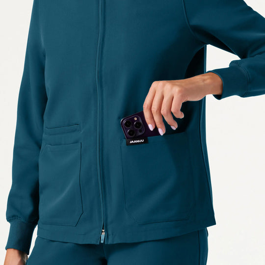 Jaanuu Scrubs Women's Ceri Essential 6-Pocket Scrub Jacket Caribbean Blue | scrub-supply.com
