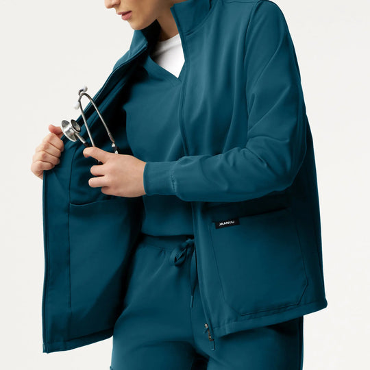 Jaanuu Scrubs Women's Ceri Essential 6-Pocket Scrub Jacket Caribbean Blue | scrub-supply.com