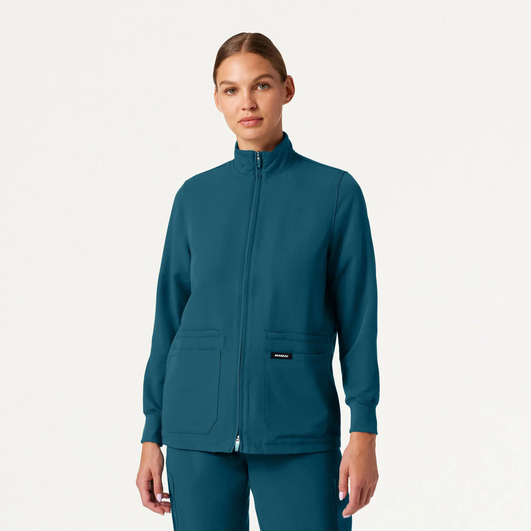 Jaanuu Scrubs Women's Ceri Essential 6-Pocket Scrub Jacket Caribbean Blue | scrub-supply.com