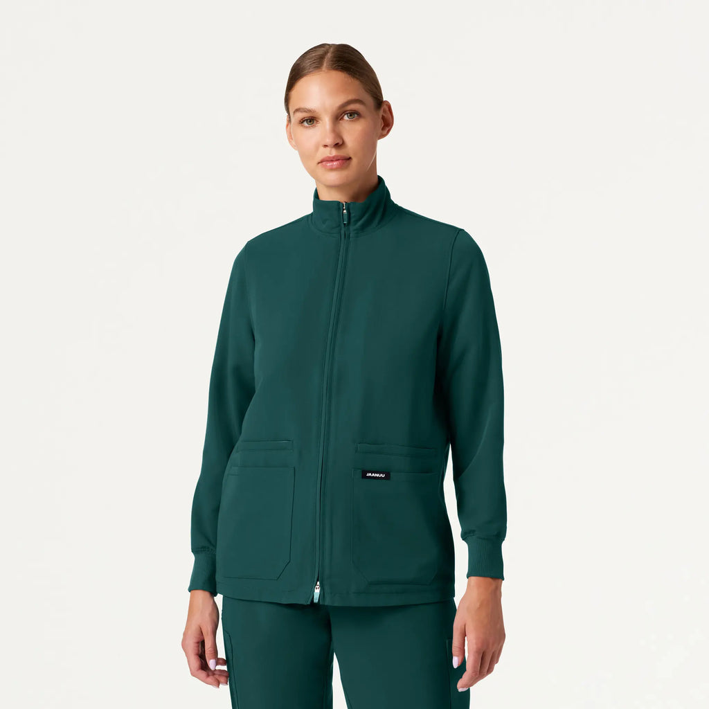 Jaanuu Scrubs Women's Ceri Essential 6-Pocket Scrub Jacket Midnight Green | scrub-supply.com