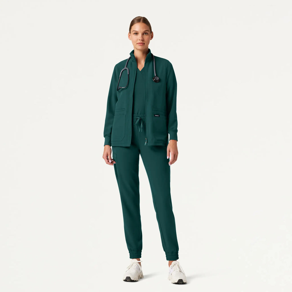 Jaanuu Scrubs Women's Ceri Essential 6-Pocket Scrub Jacket Midnight Green | scrub-supply.com